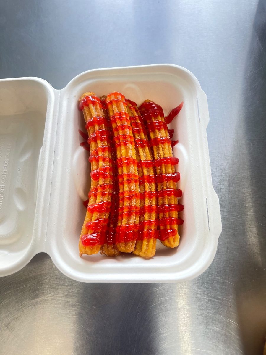 Churro plate with strawberry sauce